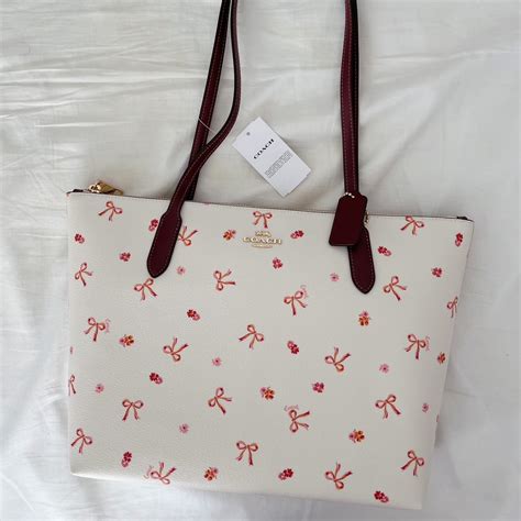 coach bow print tote.